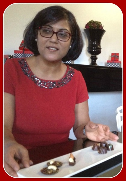 Aarti Khosla, in her red-and-black-themed chocolate shop.